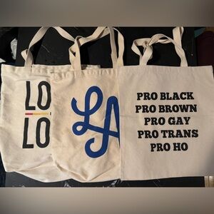 Set of three tote bags.  Two washed and used and third “PRO” bag is bran…​​